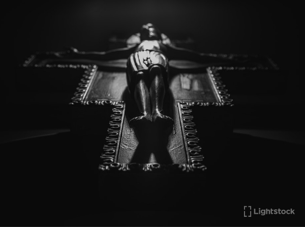 Black man reading the Bible in his living room